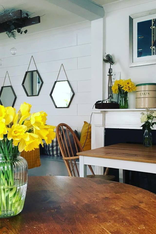 Emily's cafe in Truro Cornwall wooden tables yellow daffodils