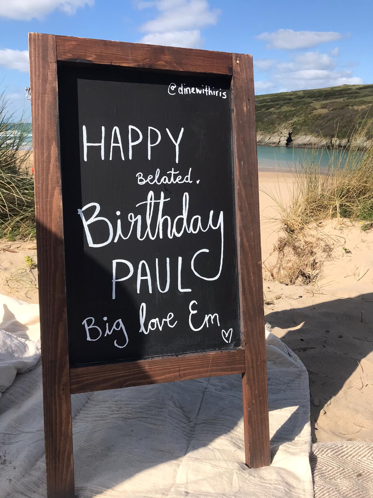Happy Birthday Paul blackboard on beach