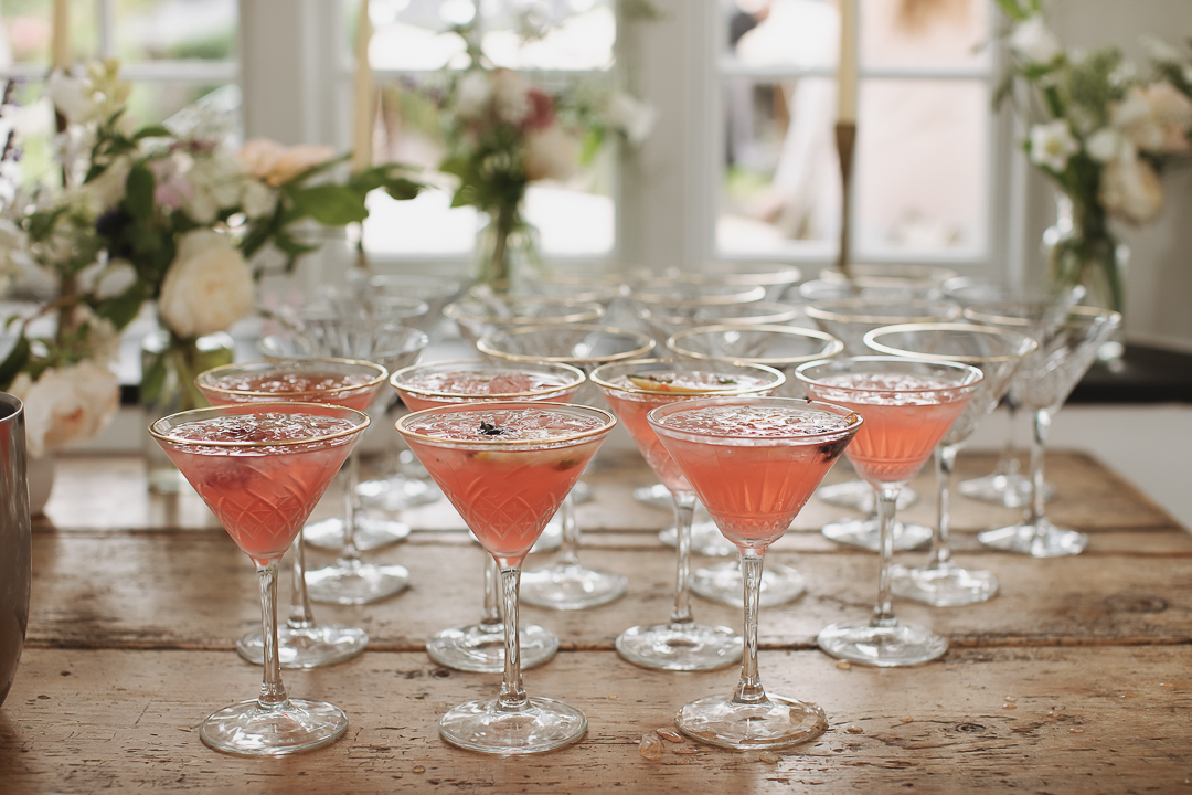pink cocktails in martini glasses on table