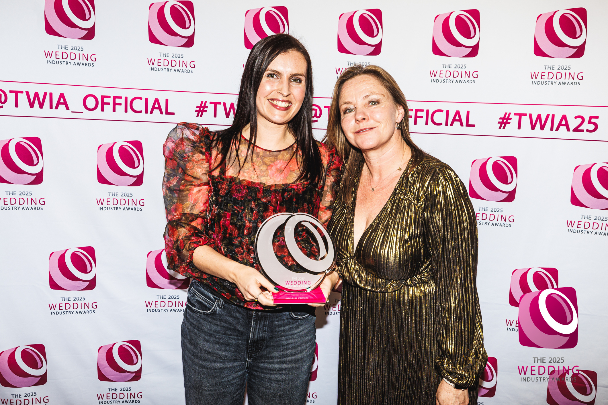 Treseren Izzy and Emma collecting award for best wedding venue at TWIA awards 2025