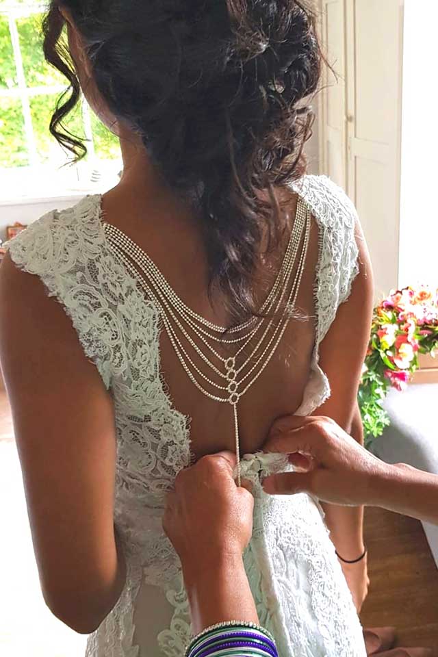 delicate chain detail at back of wedding dress