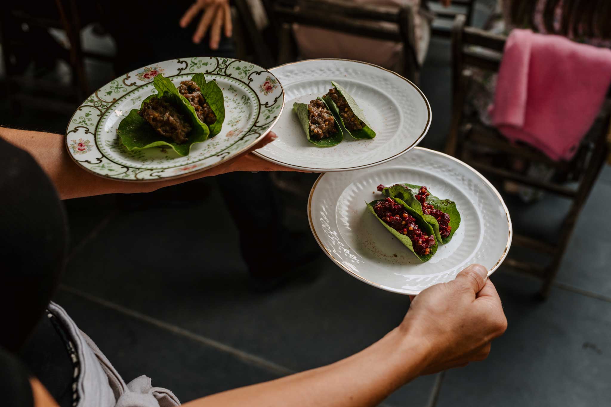 Adam Banks supper club at Treseren carrying plates