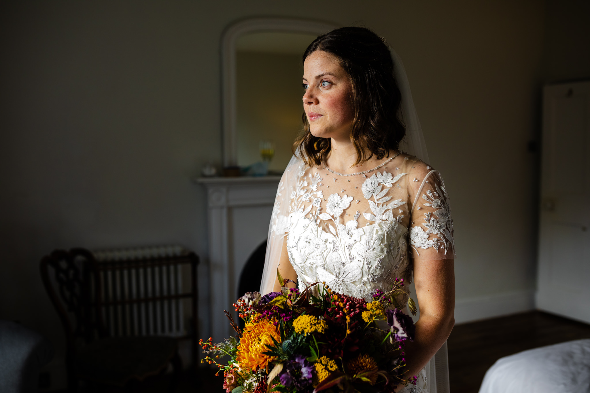 bride in wedding dress holding flowers