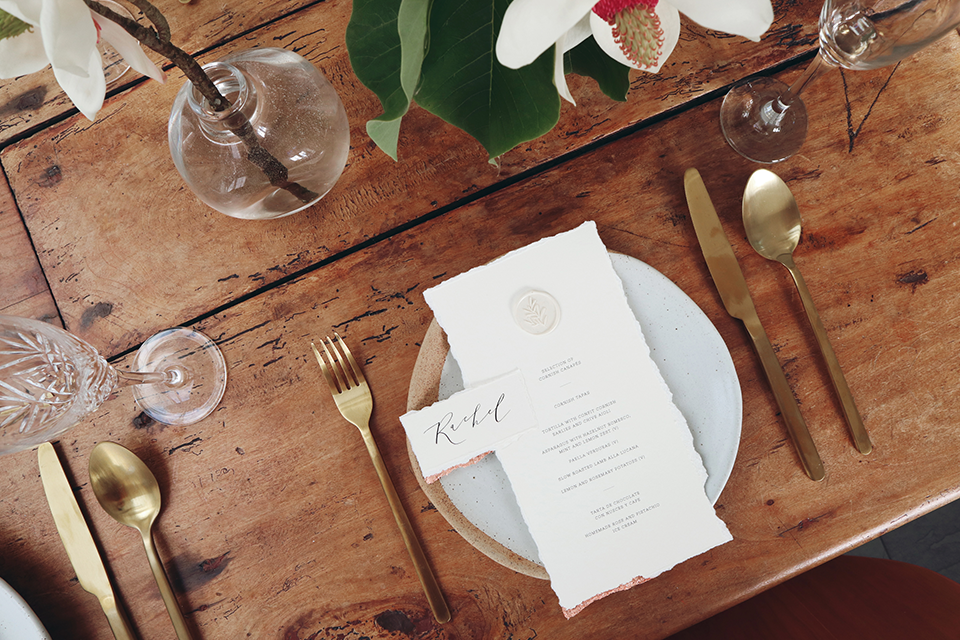 Wedding breakfast table setting gold cutlery calligraphy menu