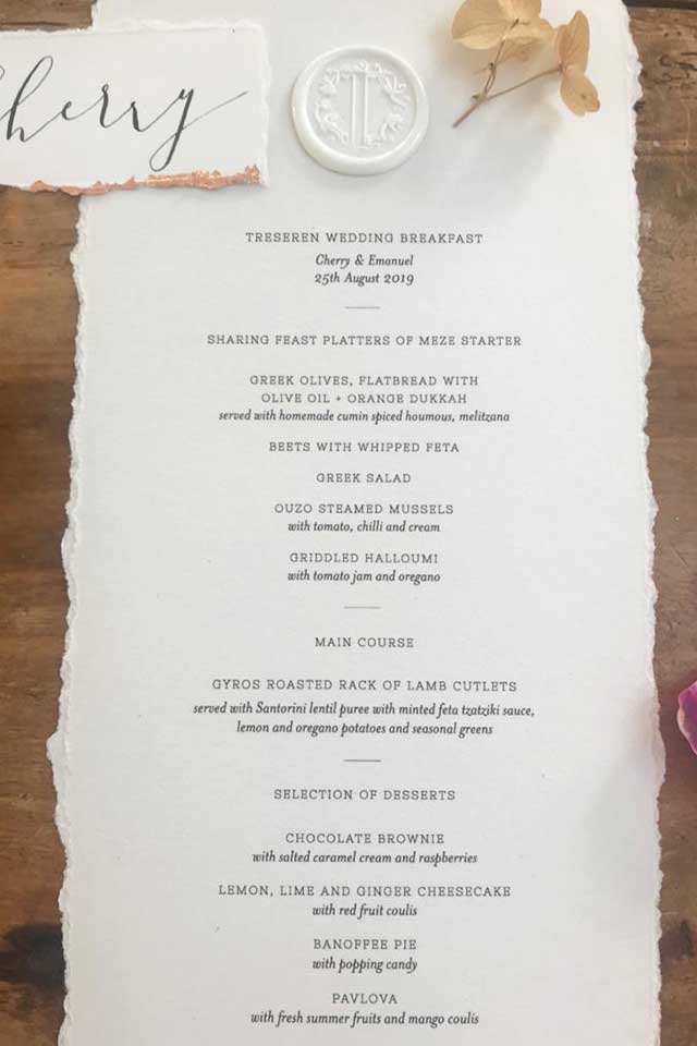 wedding menu on textured paper with torn edges