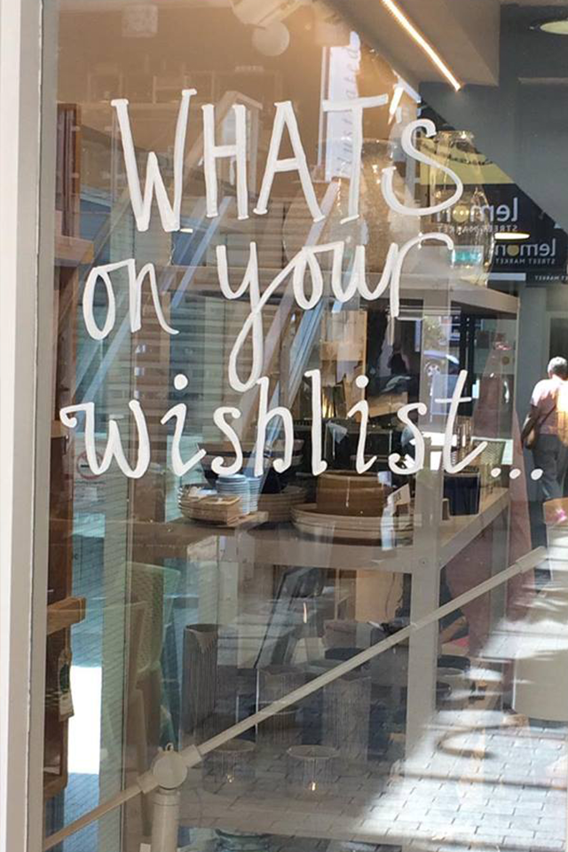 Whats on your wishlist shop sign writing on glass